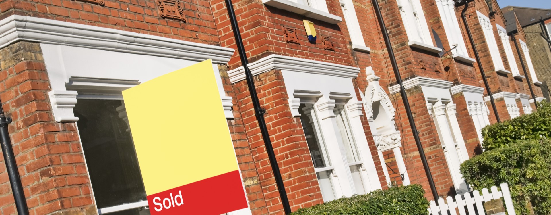 House with sold sign